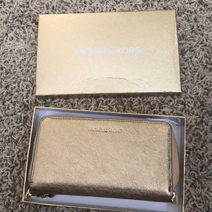 Michael Kors gold wristlet/wallet